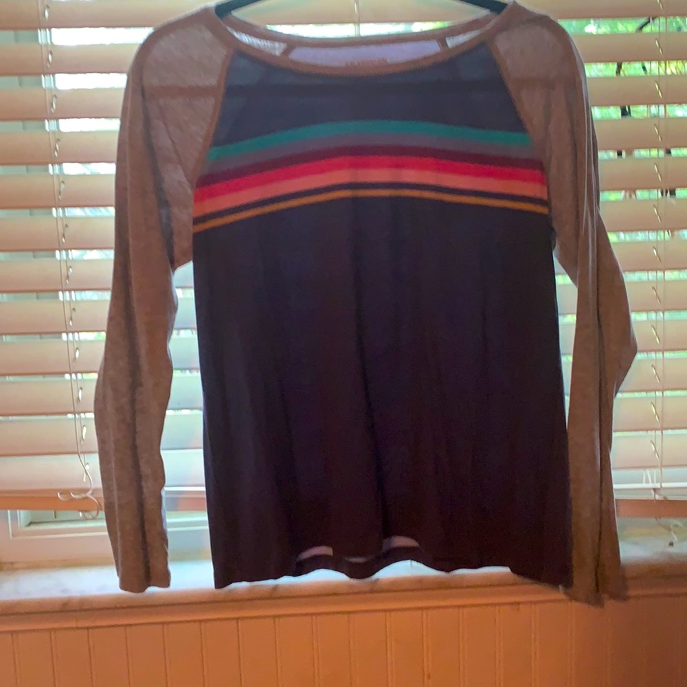 Navy long sleeve with a rainbow strip across it.
